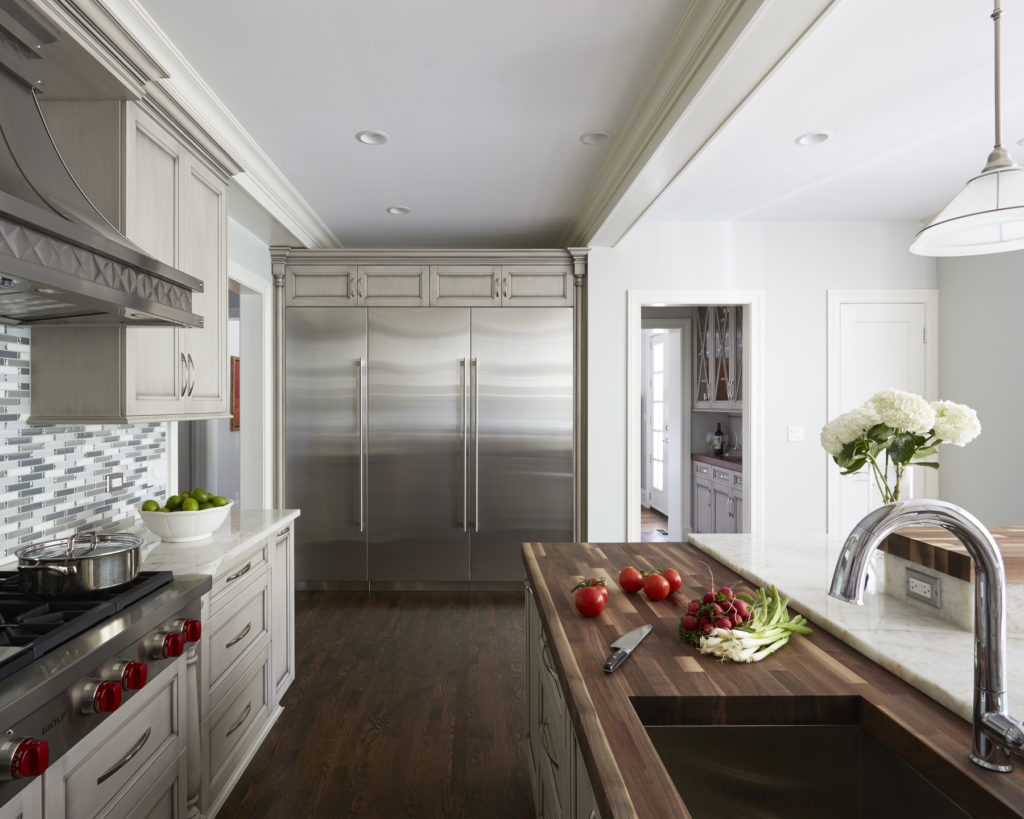 Painted warm grey kitchen in Winnetka by Dream Kitchens